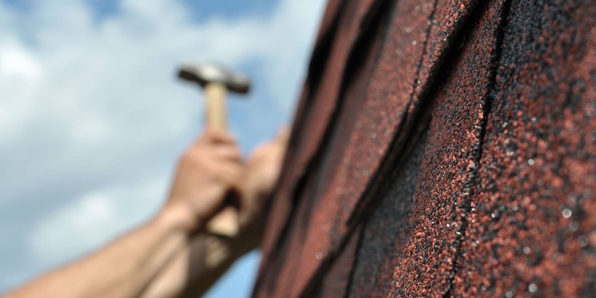 hammer hitting roof