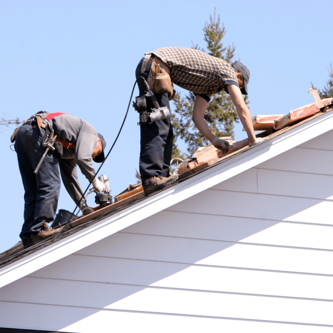 roofers on white house